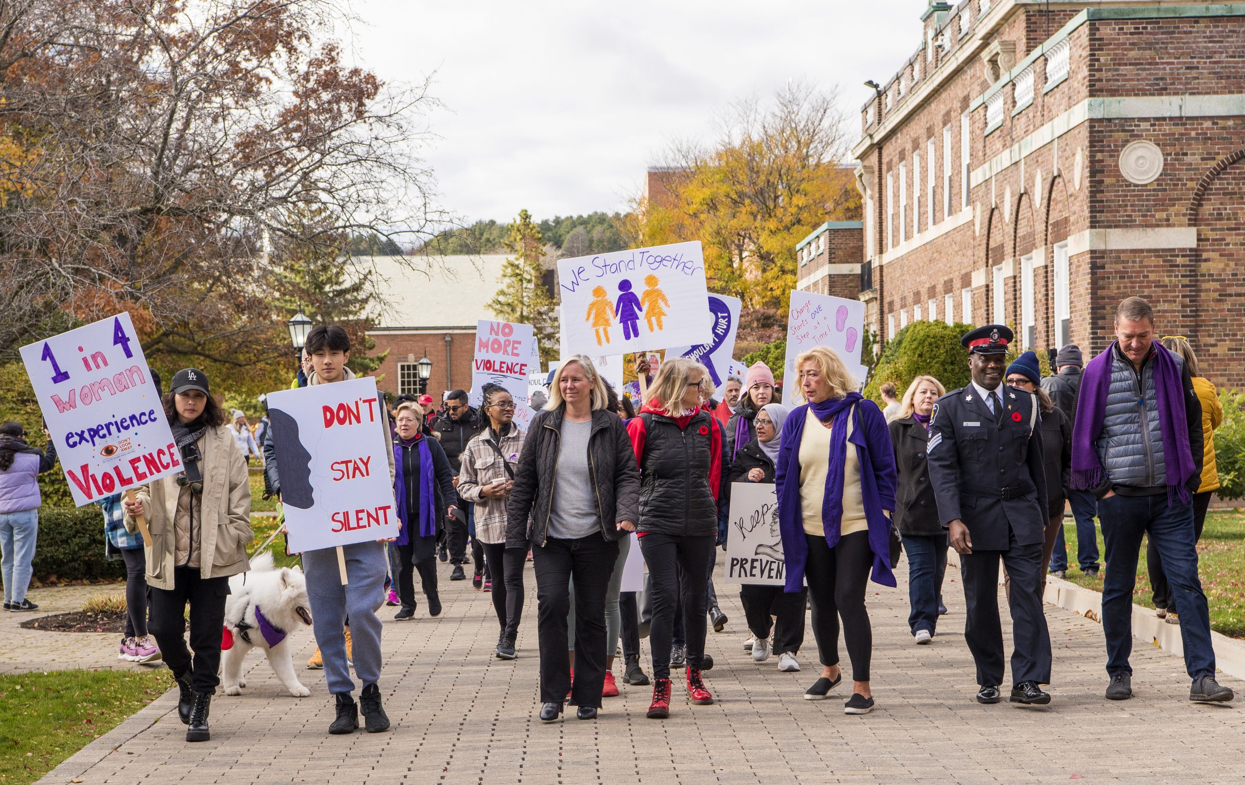 A group of participants walking together at Yellow Brick House’s Break the Silence Walk to end domestic violence.